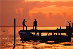 Sunset chatting on the beatiful island of Roatan, Honduras. by Shawn Jackson 